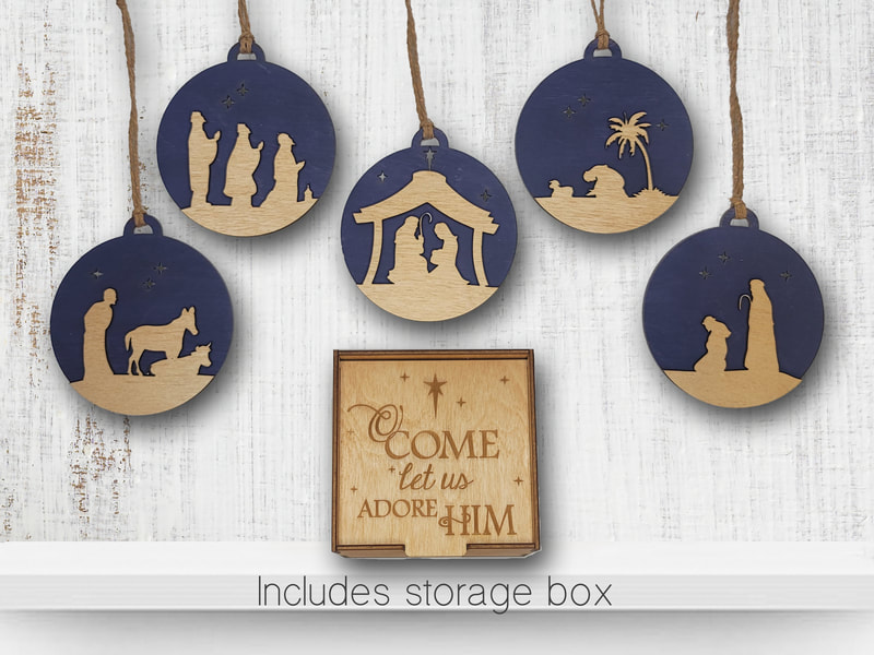 Wood nativity Christmas ornaments with dark blue background and light wood silhouettes, including a storage box.