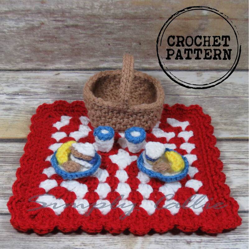 Crochet picnic playset that includes blanket, picnic basket, plates, cups, peanut butter and jelly sandwiches, bananas and cookies.