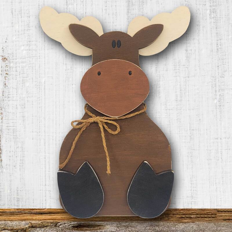 Handmade wood moose decor for cabin or nursery.